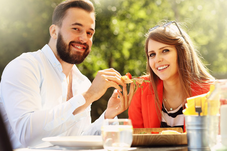 Picture of young couple in restaurantの写真素材