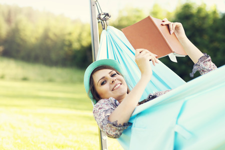 Picture of young woman relaxing in hammockの写真素材