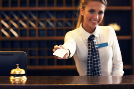 Picture of receptionist giving key card