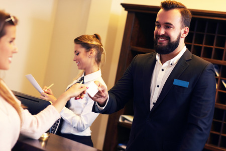 Picture of guests getting key card in hotelの写真素材