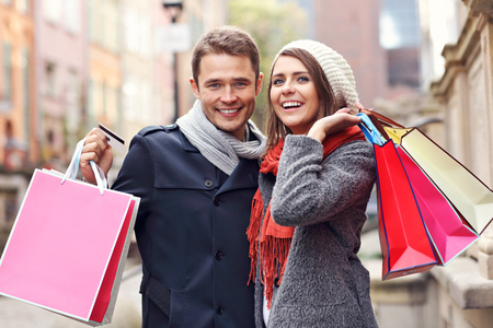 Picture showing young couple shopping in the cityの写真素材