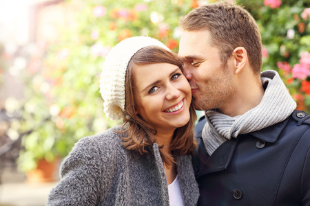 Picture of happy couple kissing in the cityの写真素材
