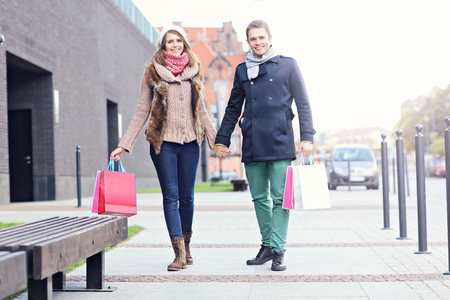 Picture showing young couple shopping in the cityの写真素材