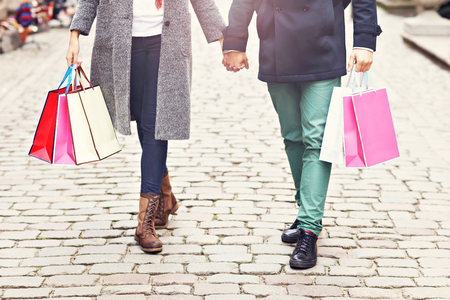 Downsection showing couple shopping in the cityの写真素材