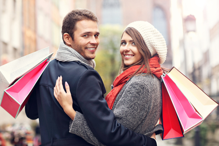 Picture showing young couple shopping in the cityの写真素材