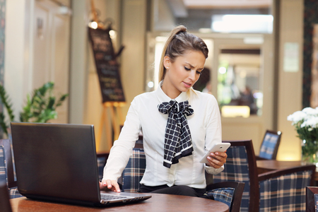 Picture of young businesswoman working cafeの写真素材