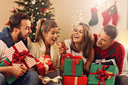 Picture showing group of friends celebrating Christmas at homeの写真素材