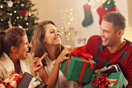 Picture showing group of friends celebrating Christmas at homeの写真素材