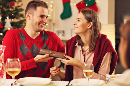 Picture of happy couple with Christmas presentsの写真素材