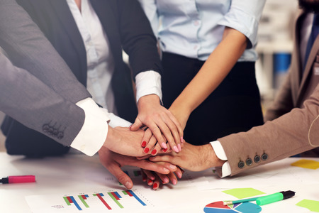 Picture showing hands of business people working in team
