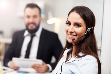 Picture showing pretty woman in call centerの写真素材