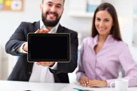 Businesspeople using their tabletの写真素材