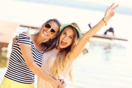 Beautiful woman with towel after bath isolated on white backgroundの写真素材