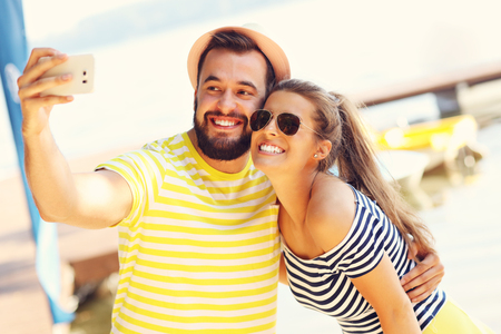 Happy couple having fun outdoors in summerの写真素材