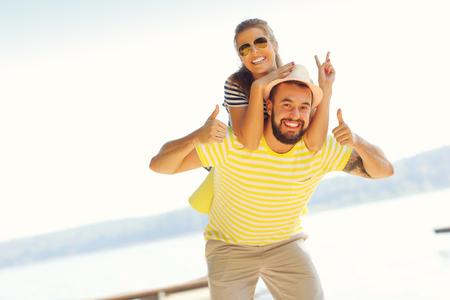 Happy couple having fun outdoors in summerの写真素材