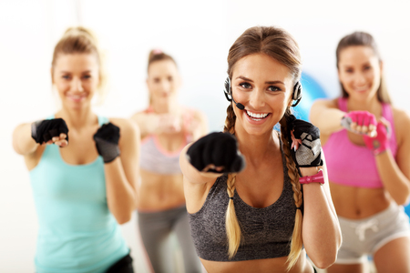 Group of smiling people doing aerobicsの写真素材