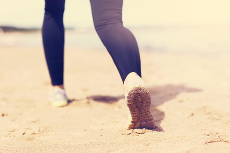 Woman jogging on the beachの写真素材