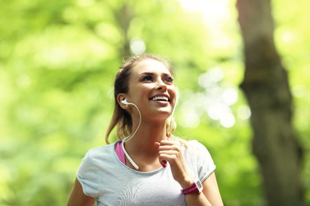 Woman jogging in the forestの写真素材