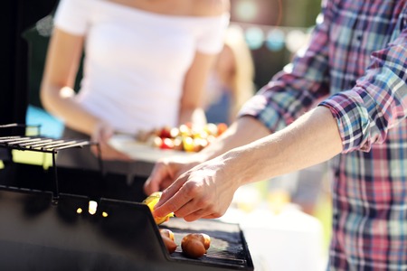 Friends having barbecue party in backyardの写真素材