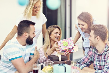 Group of friends having fun at birthday partyの写真素材