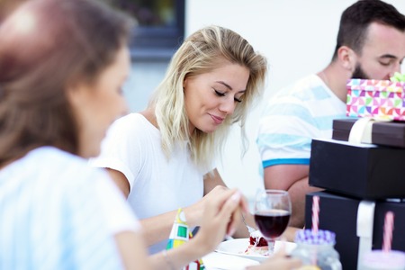 Group of friends having fun at birthday party