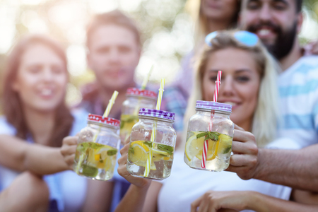 Friends having barbecue party in backyardの写真素材