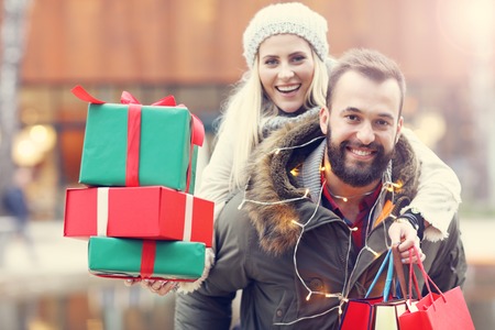 Picture of couple shopping for Christmas in the cityの写真素材