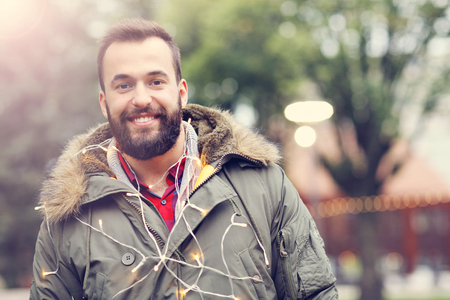 Adult man outdoors during fall timeの写真素材