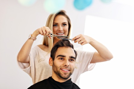 Adult man at the hair salonの写真素材