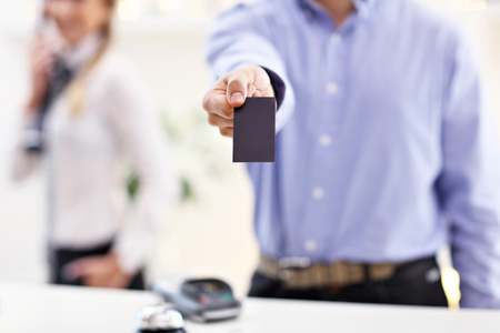 Picture showing happy receptionist working in hotelの写真素材