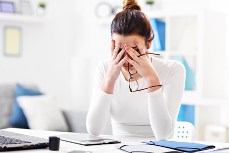 Woman working in her home officeの写真素材