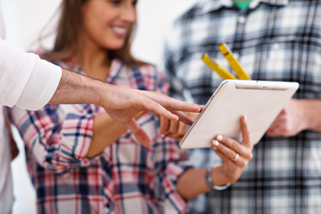 Happy adult couple moving out or in to new homeの写真素材