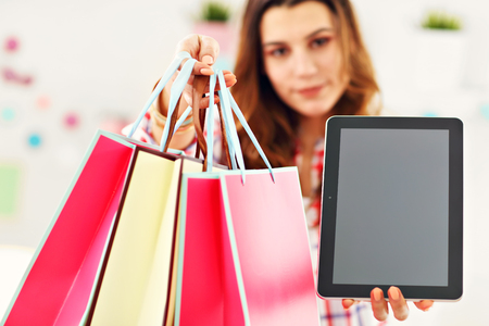 Attractive woman buying Easter gifts onlineの写真素材