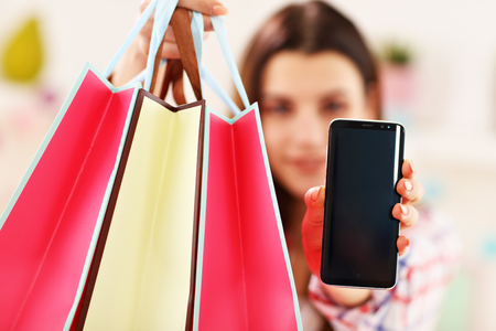 Attractive woman buying Easter gifts onlineの写真素材