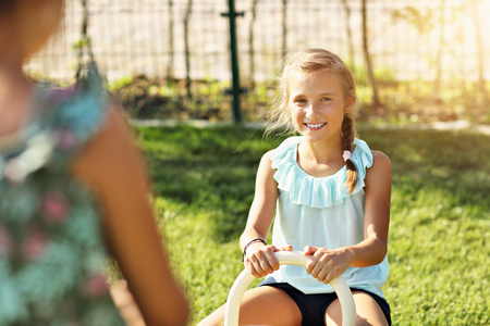 Joyful children having fun on playgroundの写真素材