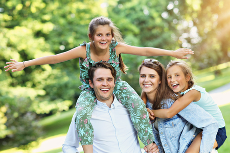 Young family with children having fun in natureの写真素材