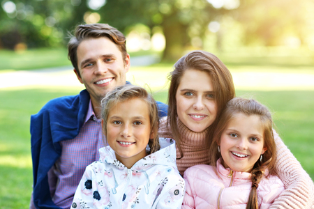 Young family with children having fun in natureの写真素材