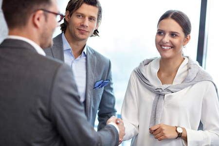 Group of business people introducing one anotherの写真素材