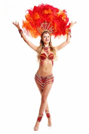 Brazilian woman posing in samba costume over white background