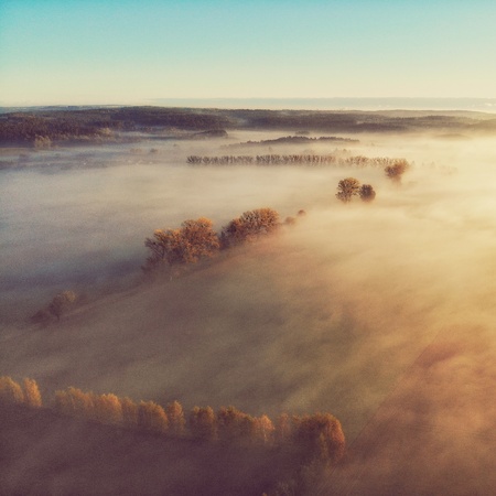 Top view aerial shot of foggy Polish villageの写真素材