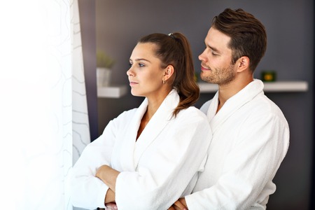 Adult happy couple relaxing in spa salonの写真素材