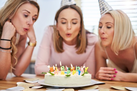 Picture presenting happy group of friends celebrating birthday