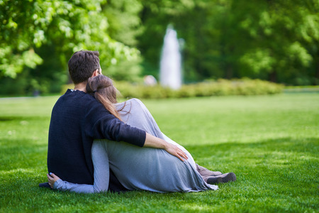 Young couple strolling in the parkの写真素材