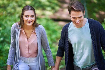 Picture of young couple strolling in the parkの写真素材