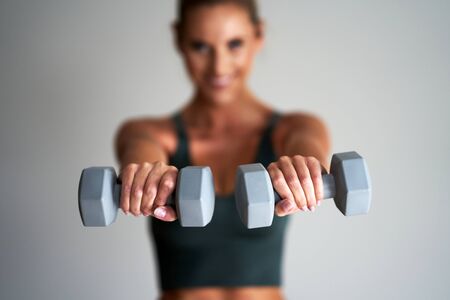 Adult woman practising yoga at homeの写真素材