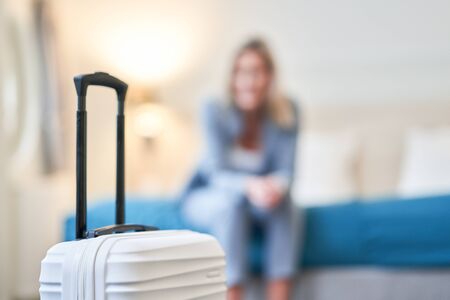 Businesswoman resting in hotel roomの写真素材