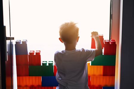 Little boy building a wall at home quarantine during coronavirus pandemicの写真素材