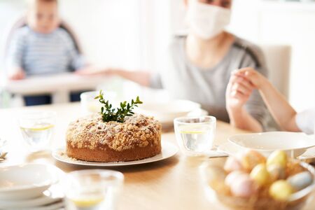 Family at home quarantine over Easter tableの写真素材