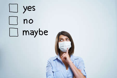 Attractive woman wearing protective mask isolated over white background