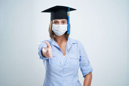 Student wearing protective mask isolated over white backgroundの写真素材